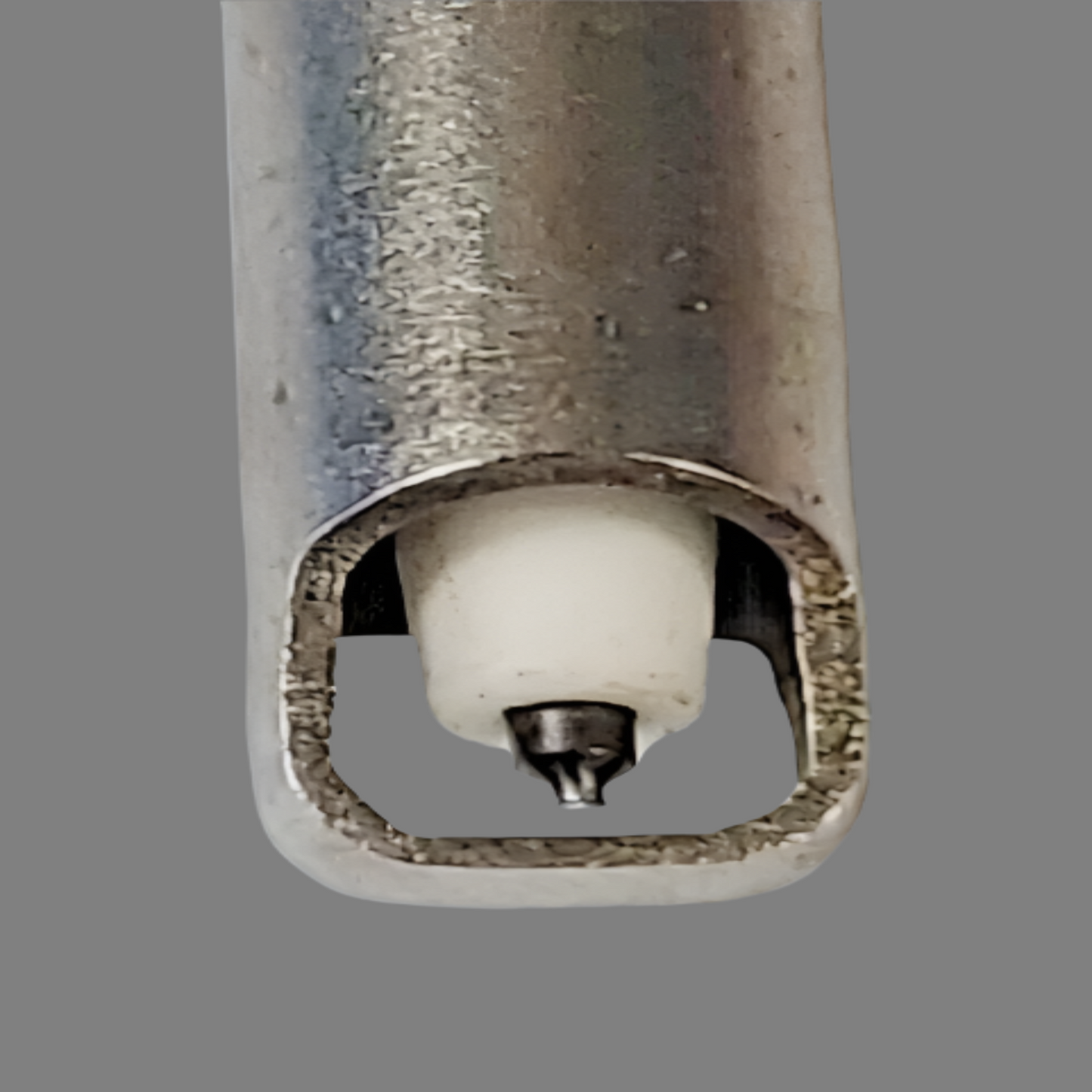 Close-up of a metal spray nozzle on a white background