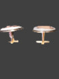 Pair of cufflinks on a flat surface