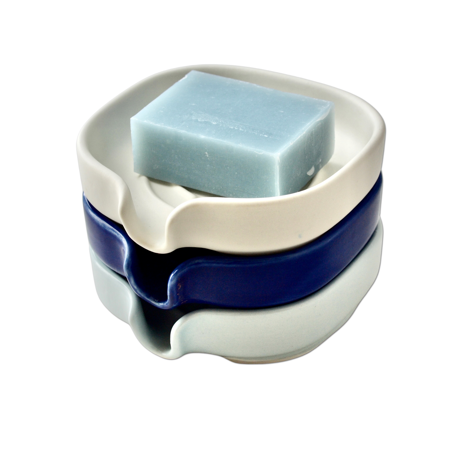 Stacked soap dishes in soft celery, glossy blue and soft white. Soap not included.