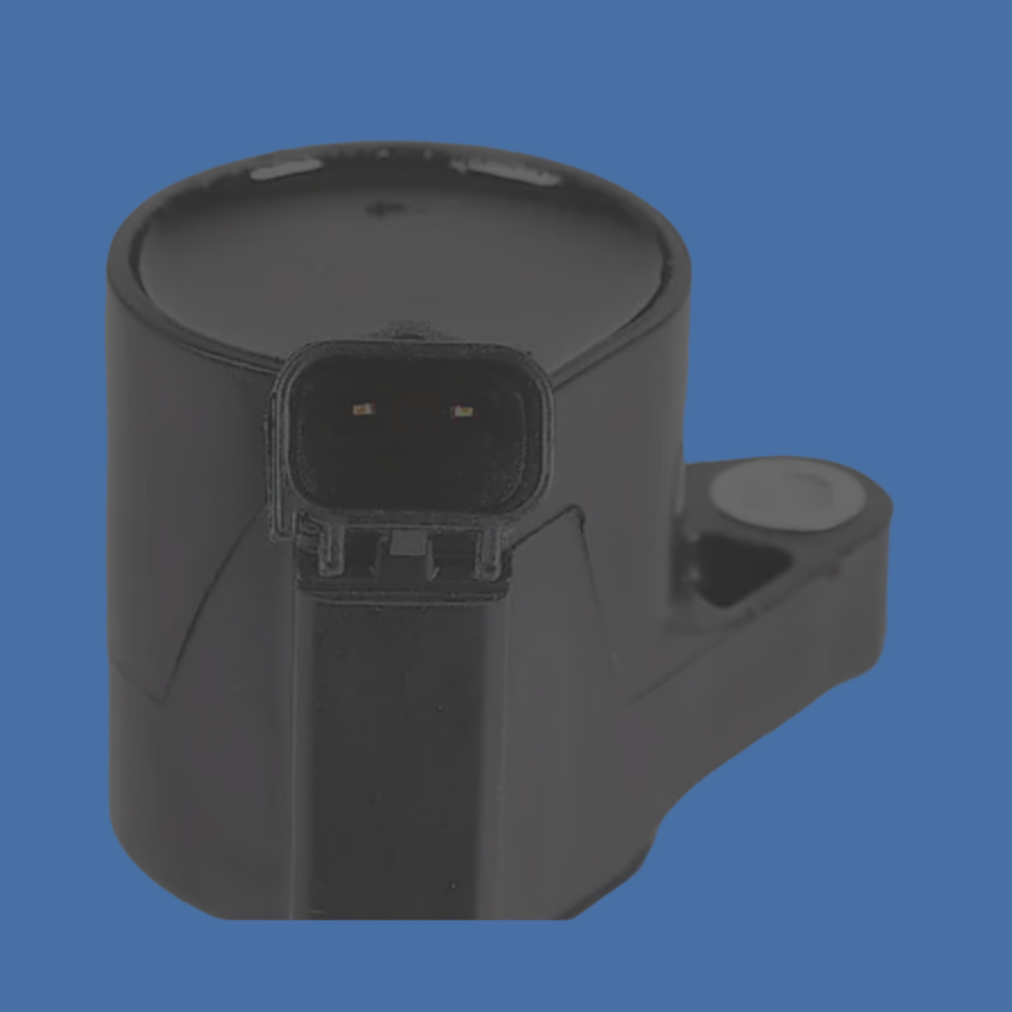 Black automotive sensor on a gray background