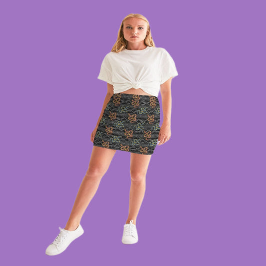 Woman wearing a white t-shirt and patterned skirt on a white background