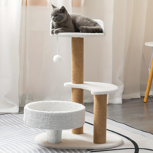 Cat sitting on a multi-level cat tree with white cushioned platforms and brown sisal-covered posts.