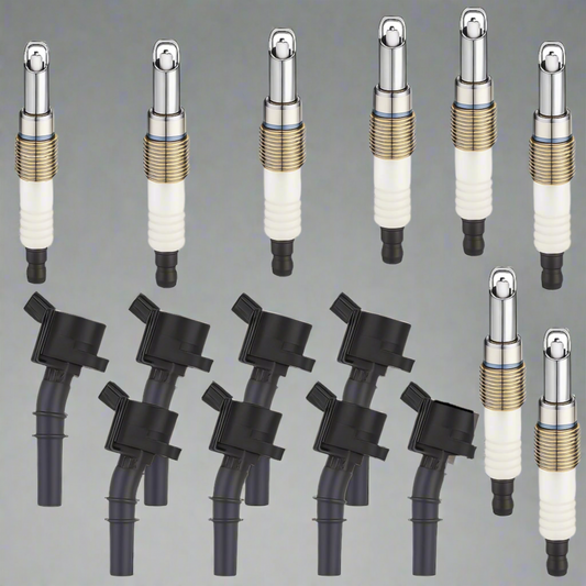 Set of spark plugs and ignition coils on a white background