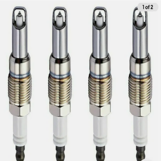 Four spark plugs arranged in a row on a white background