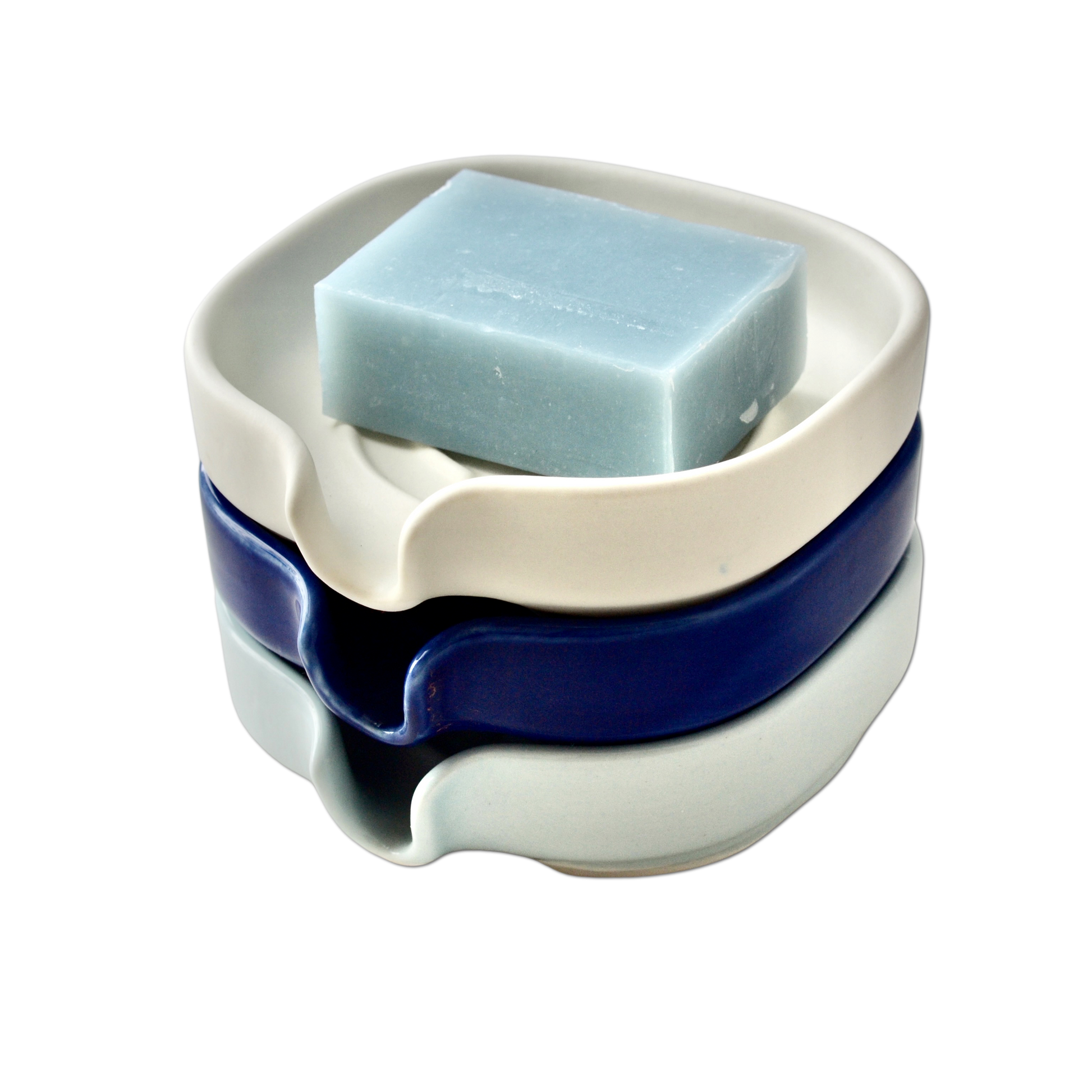 Stacked soap dishes in soft celery, glossy blue and soft white. Soap not included.