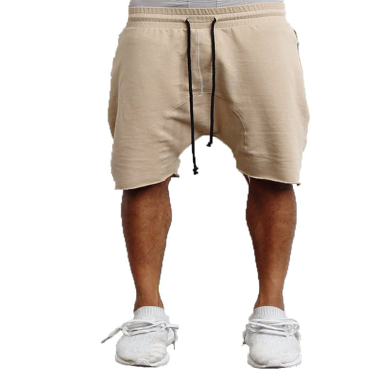 Beige shorts with drawstring on a white background