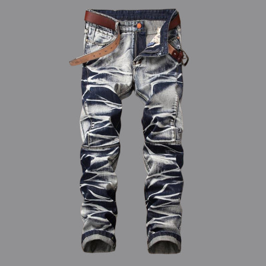 Distressed jeans with a brown belt on a wooden surface